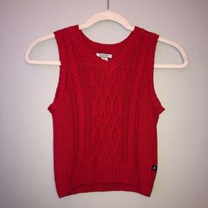 red sweater vest